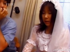 oriental in bride suit touching her body
